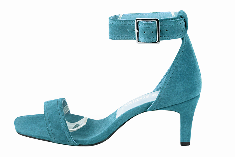 Peacock blue women's closed back sandals, with a strap around the ankle. Square toe. Medium comma heels. Profile view - Florence KOOIJMAN